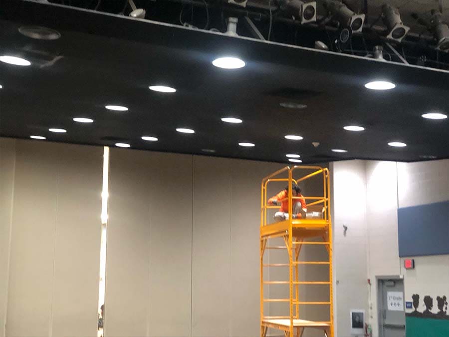 AM electric team installed LED lighting in the auditorium using our Scaffold.